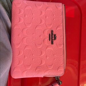 Coach pink embossed leather wristlet, new